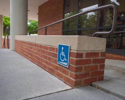 handicap sign with ramp on campus